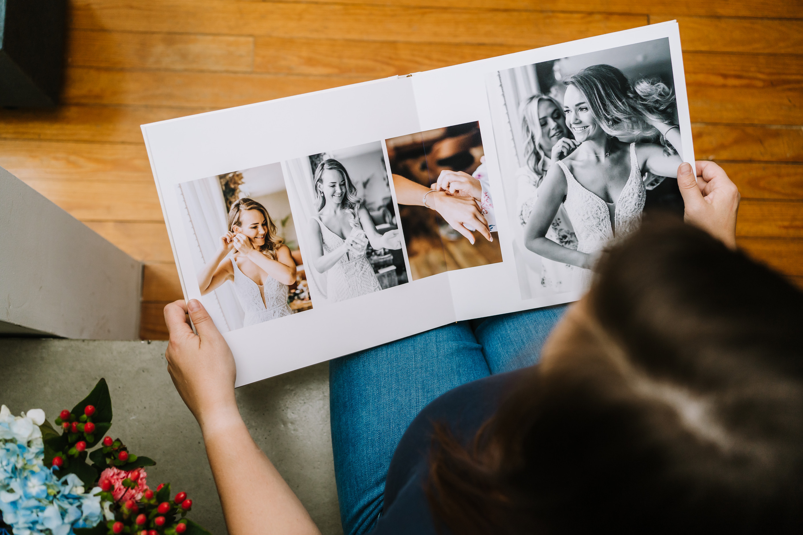 Women viewing high end wedding photo book